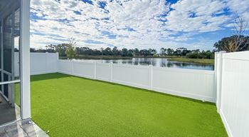 Private fenced-in backyards with turf