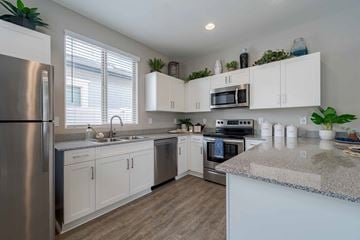 Glendale apartment for rent - A kitchen with white cabinets and a granite countertop.