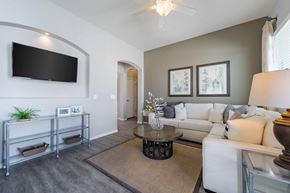 Surprise apartment for rent - Contemporary living room with mounted television at Vistoria On Greenway Apartments, Surprise, AZ