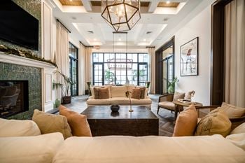 A living room filled with furniture and a fireplace