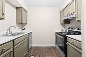 Oklahoma City apartment for rent - a kitchen with stainless steel appliances and white cabinets at Diamond  Trail Apartments, Oklahoma City, 73112