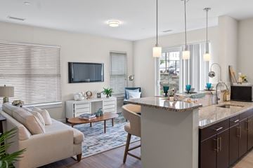 Ashland apartment for rent - a living room with a kitchen and a television