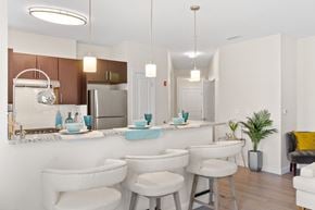 Ashland apartment for rent - a kitchen and dining area in a 555 waverly unit at Cirrus Apartments, Ashland, MA
