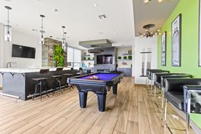 Lakewood apartment for rent - a game room with a pool table and bar at Union West Apartments, Lakewood, 80228