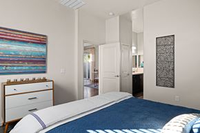 Queen Creek apartment for rent - a bedroom with a bed and a bathroom with a sink at Olive Queen Creek Apartments, Queen Creek, AZ