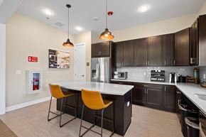 Hazlet apartment for rent - a kitchen with a large island with two orange chairs at The Landing Apartment , Hazlet