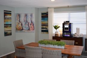 Largo apartment for rent - a dining room with a table and chairs and a coffeemaker  at Somerset Apartments, Largo