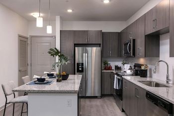 Stainless steel appliance package w/ side-by-side refrigerator w/ ice maker & water in door