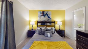 Tampa apartment for rent - a bedroom with a bed and two night stands with lamps at Laurel Oaks Apartments, Tampa, Florida