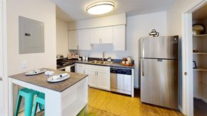 Largo apartment for rent - a kitchen with stainless steel appliances and white cabinets  at Somerset Apartments, Largo, FL, 33774