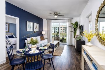 Fort Myers apartment for rent - a living room and dining room with a couch and a table