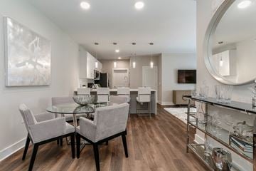 Murfreesboro apartment for rent - a living room and dining room with a glass table and chairs