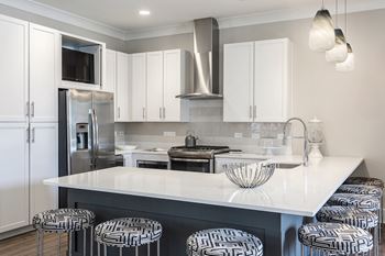 Clubhouse kitchen with stainless steel appliances and white cabinets