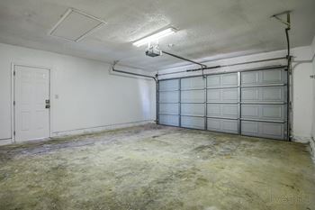 The living room of an empty garage with a door