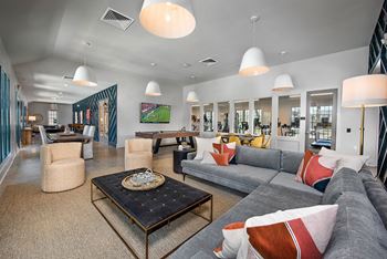 A living room with couches and chairs and a table