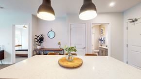 St. Paul apartment for rent - A dining room with a table and chairs. at The Arlow on Kellog, St. Paul, MN
