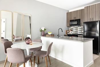 Modern kitchen with marble dining table and mirrors