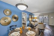 Houston apartment for rent - A dining room with a table set for a meal.