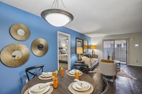 Houston apartment for rent - A dining room with a table set for a meal.