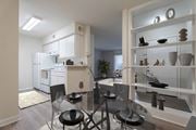 Houston apartment for rent - A modern kitchen with a glass dining table and chairs.