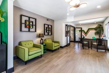 College Station apartment for rent - a living room and dining room with green furniture