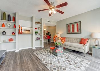 Living room with a ceiling fan and a coffee table