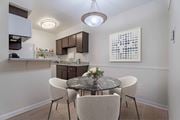 Houston apartment for rent - A kitchen with a table and chairs in the foreground.