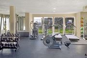 College Station apartment for rent - A spacious gym with a variety of equipment including treadmills, weights, and exercise machines.