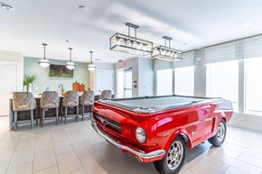 Daytona Beach apartment for rent - a game room with a pool table and a red car