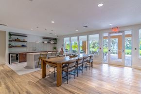 Mount Dora apartment for rent - A modern kitchen with a dining table and chairs.