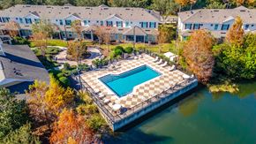 Winter Park apartment for rent - An aerial view of a pool surrounded by a fence and trees.