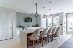Orange City apartment for rent - a kitchen with a long counter and a tv on the wall