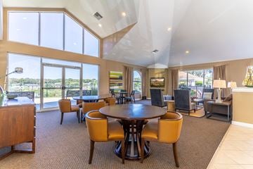 Orlando apartment for rent - a large living room with a table and chairs