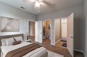 Lady Lake apartment for rent - A bedroom with a large bed and a ceiling fan.