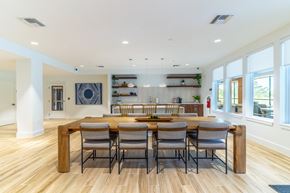 Mount Dora apartment for rent - A dining room with a wooden table and chairs.