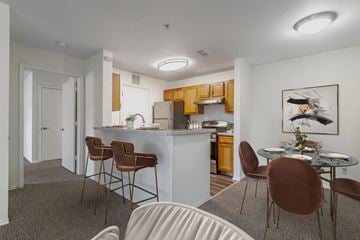 Kissimmee apartment for rent - A kitchen with a dining table and chairs.