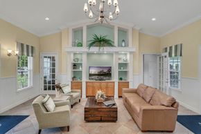 Fruitland Park apartment for rent - clubhouse area with couches and tv