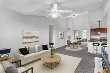 Kissimmee apartment for rent - A living room with a white couch and a coffee table.