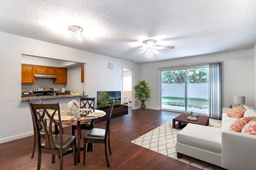 Orlando apartment for rent - a living room and dining room with a couch and a table