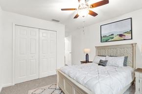 Oviedo apartment for rent - a bedroom with a bed and a ceiling fan