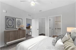 Palm Coast apartment for rent - A bedroom with a bed, dresser, and mirror.