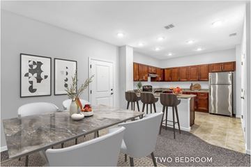 Palm Coast apartment for rent - A modern kitchen with a dining table and chairs.