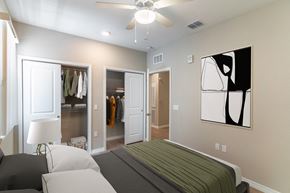 Lady Lake apartment for rent - a bedroom with a bed and a ceiling fan