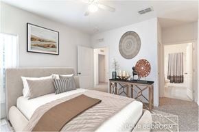 Palm Coast apartment for rent - A bedroom with a large bed and a painting on the wall.