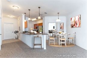 Palm Coast apartment for rent - A kitchen with a dining table and chairs is shown in the image.