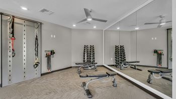 24 Hour fitness and conditioning club w/ state of the art multi-functional training equipment, kettle bells, dumb bells and isa wall for full body conditioning