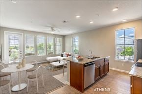 Deland apartment for rent - A modern kitchen with a dining table and chairs.