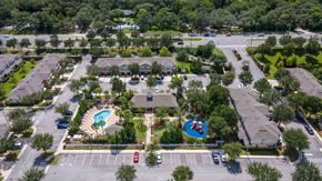 Oviedo apartment for rent - an aerial view of a community with several houses and a swimming pool