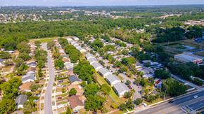 Orlando apartment for rent - an aerial view of a neighborhood with houses and trees