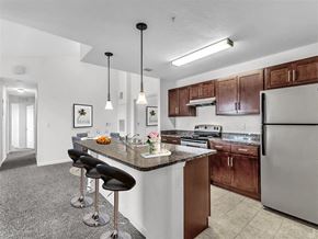Kissimmee apartment for rent - a kitchen with a counter top next to a stove top oven